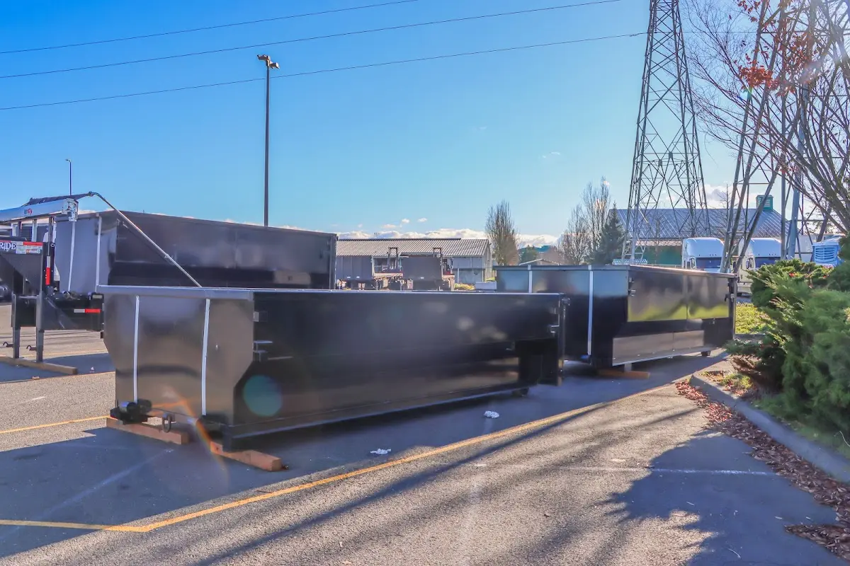 Roll-off dumpster ready for waste disposal at job site for Concrete Dumpster Rental in Woodburn